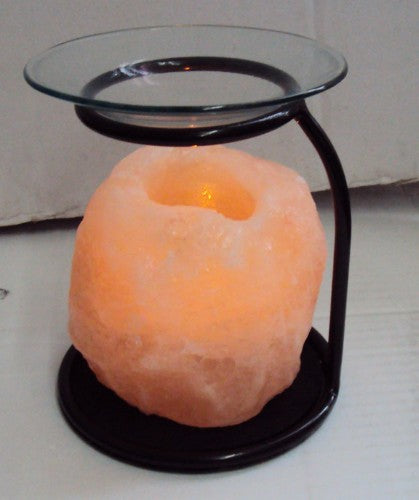 Elegant tea light holder with glass dish for fragrance oils, enhancing ambiance with soothing scents and soft light.
