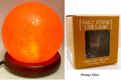 A 10cm orange Himalayan salt lamp with LED light, purifying air and creating a calming ambiance for any space.