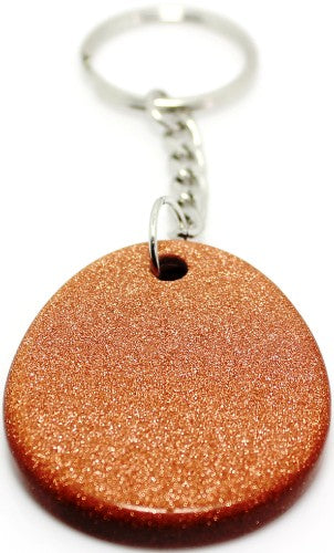 Set of 12 elegant goldstone keyrings, featuring gemstone and zodiac insights, promoting style and holistic well-being.