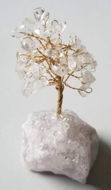 Gemstone tree with Clear Quartz crystals on a crystal base, standing 10 cm tall, promoting healing and elegance in decor.