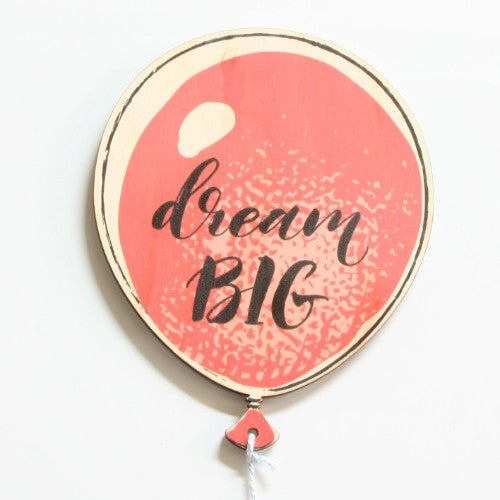 Pine wall art featuring a joyful boy holding a balloon, perfect for adding whimsy to children's rooms.