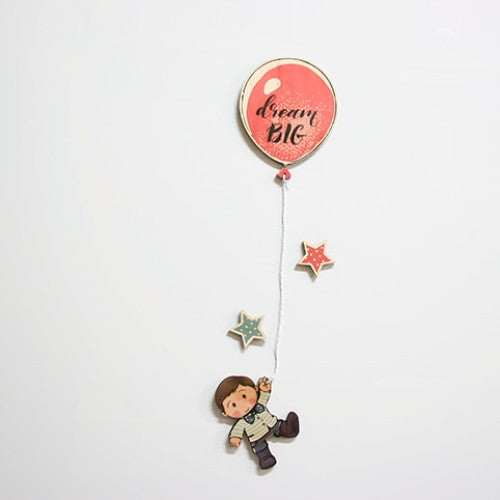 Whimsical pine wall art featuring a boy joyfully holding a balloon, perfect for nurseries and playrooms.