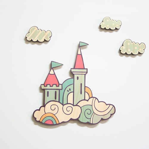 Handcrafted pine wall art set featuring a whimsical castle surrounded by three clouds, perfect for children's rooms.