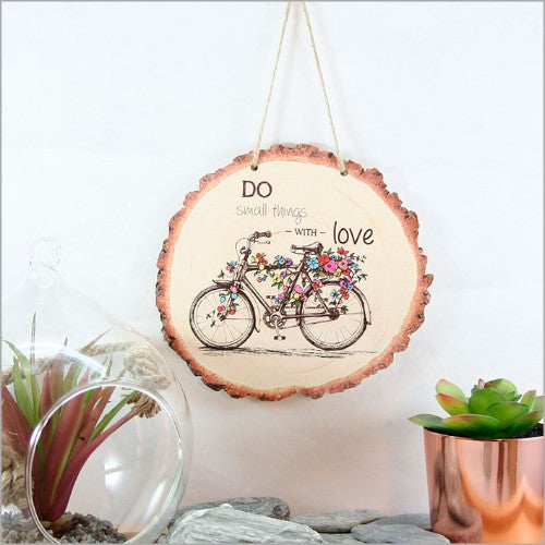 Wood slice wall art featuring a detailed bicycle design, perfect for bike lovers and nature enthusiasts. Ready to hang.