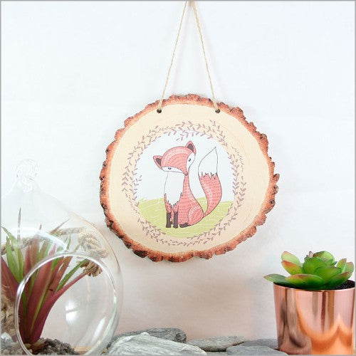 Whimsical Mr. Fox wall art on a natural wood slice, bringing rustic charm and nature indoors. Ideal for any room.