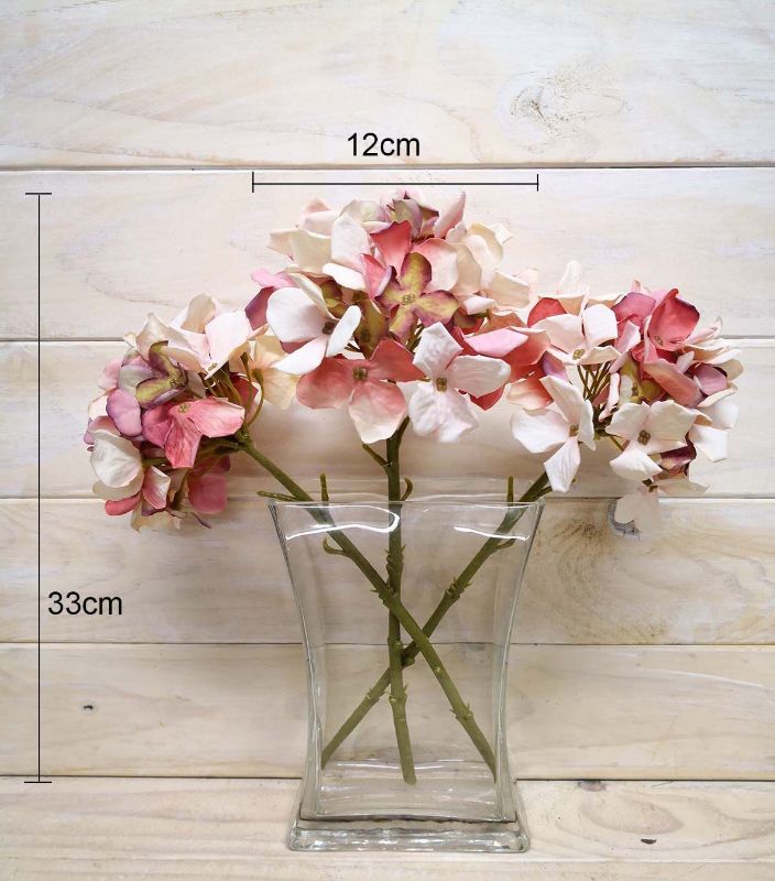 Artificial pink hydrangea cut stem, 33cm, featuring a lifelike dry look, perfect for elegant floral arrangements.