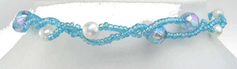 Elegant blue choker necklace with a unique double strand twist, perfect for enhancing any outfit's style.