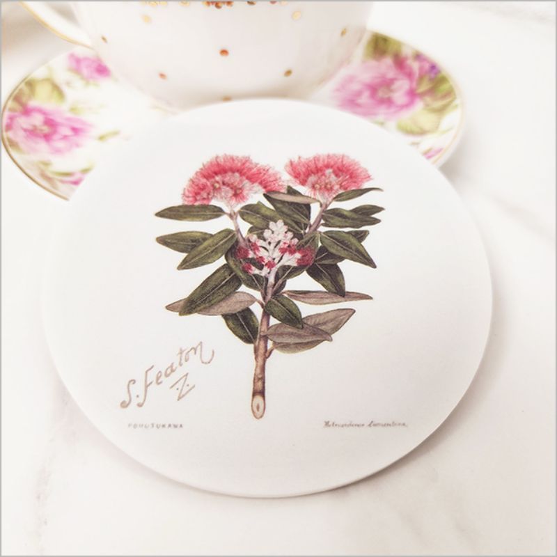 Coaster featuring Sarah Featon's vibrant Pohutukawa blossom illustration, enhancing home décor while protecting surfaces.