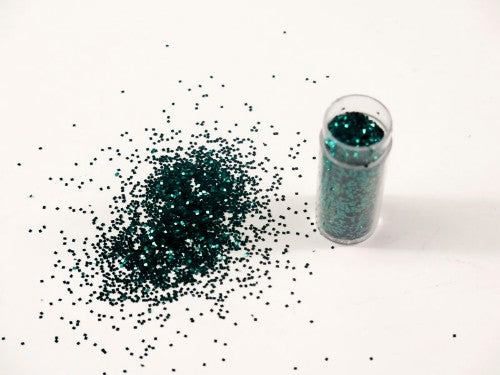 Vibrant teal glitter in 1kg for crafting, adds dazzling shimmer to projects, non-toxic and easy to apply.
