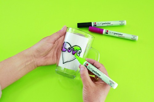 High gloss yellow glass paint pen for vibrant designs on glassware, dishwasher resistant, non-toxic and easy to use.