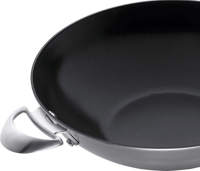 Scanpan CS Wok 32cm with Stratanium+ nonstick surface, ideal for stir-fries, features cool-touch riveted handles.