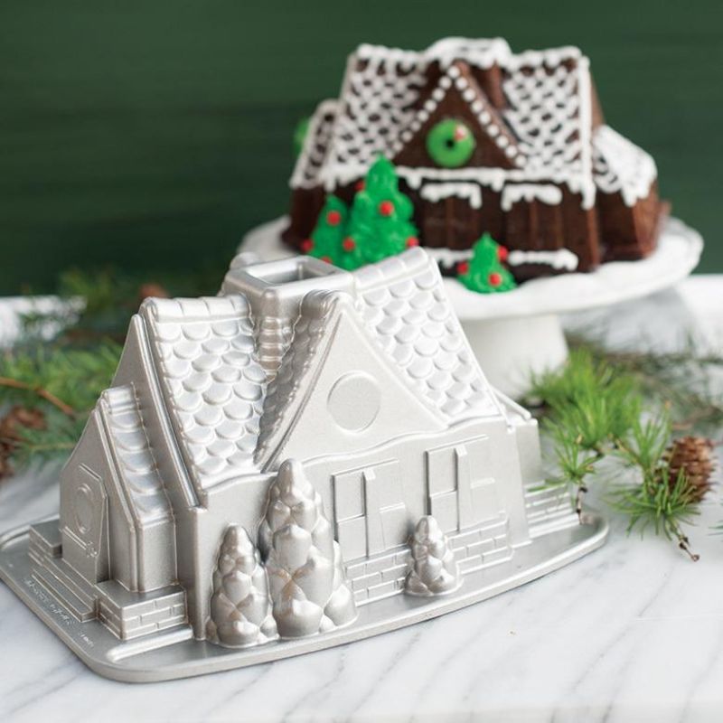 Nordic Ware Gingerbread House Bundt Pan for festive baking, featuring a 9-cup capacity and durable cast aluminum design.