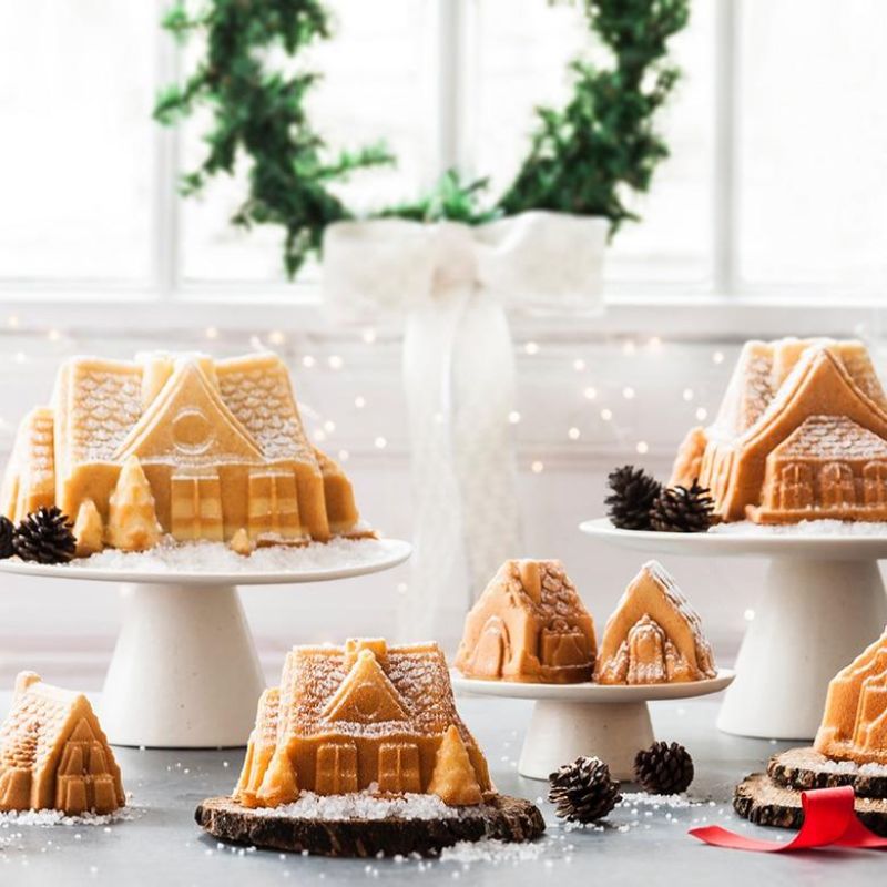 Nordic Ware Gingerbread House Bundt Pan for creating festive gingerbread cakes, featuring durable cast aluminum design.