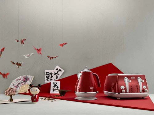 DeLonghi Icona Capitals Four Slice Toaster in Tokyo Red, featuring four wide slots, defrost, reheat, and stylish stainless steel design.