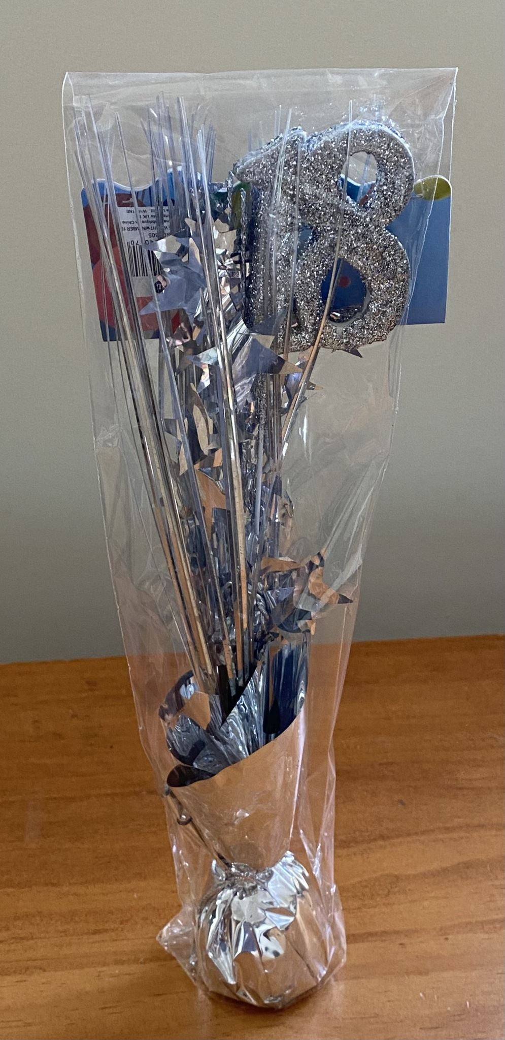 Elegant silver table weight for 18th birthday parties, enhancing decor and keeping decorations in place.