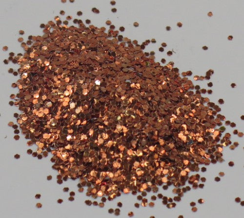 A vibrant copper glitter in a 10gm container, perfect for enhancing various crafting projects with shimmer.