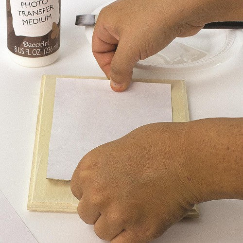 Decou-Page Photo Transfer Medium 236ml for creating decals from photos on various surfaces like wood, glass, and fabrics.