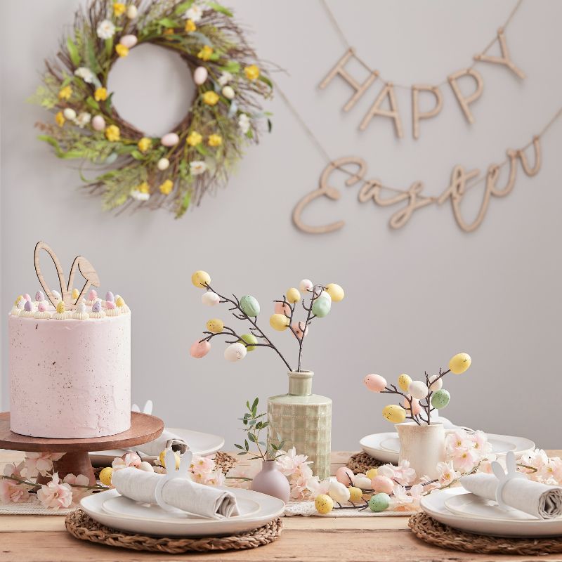 Pastel speckled egg stems for Easter, featuring 5 artificial twigs with plastic eggs, perfect for festive centerpieces.