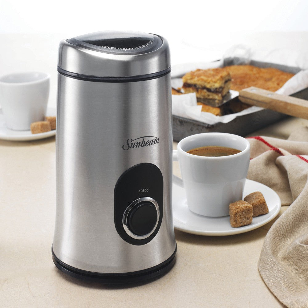 MultiGrinder II: sleek stainless steel grinder for coffee, herbs, and spices with powerful motor and one-touch operation.