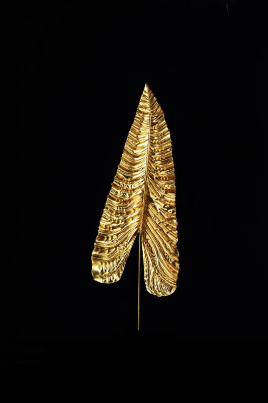 Set of 4 artificial gold anthurium leaves, 110cm tall, adding elegance to decor with realistic, flexible design.