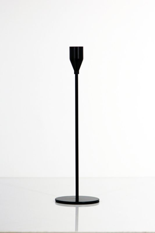 Elegant black candle sticks in a set of 5, featuring a matte finish and varying heights for sophisticated table decor.