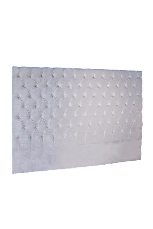 Luxurious king-sized velvet headboard in pearl with deep button tufting, enhancing bedroom elegance and comfort.