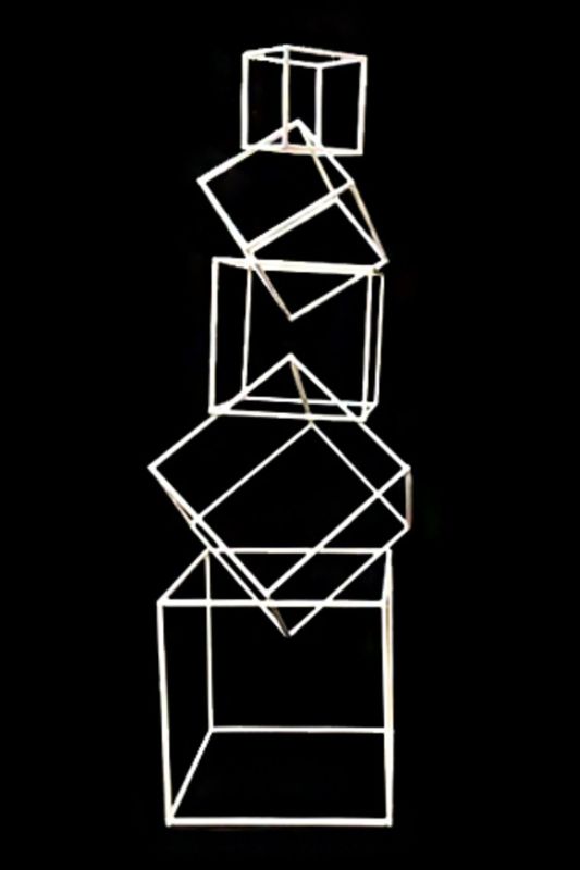 White steel cube frames set for event backdrops, featuring five graduated sizes for creative displays and decor.