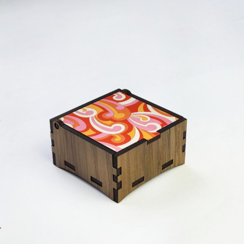 Square trinket box crafted from River Rimu wood, featuring a koru design, ideal for storing small treasures.