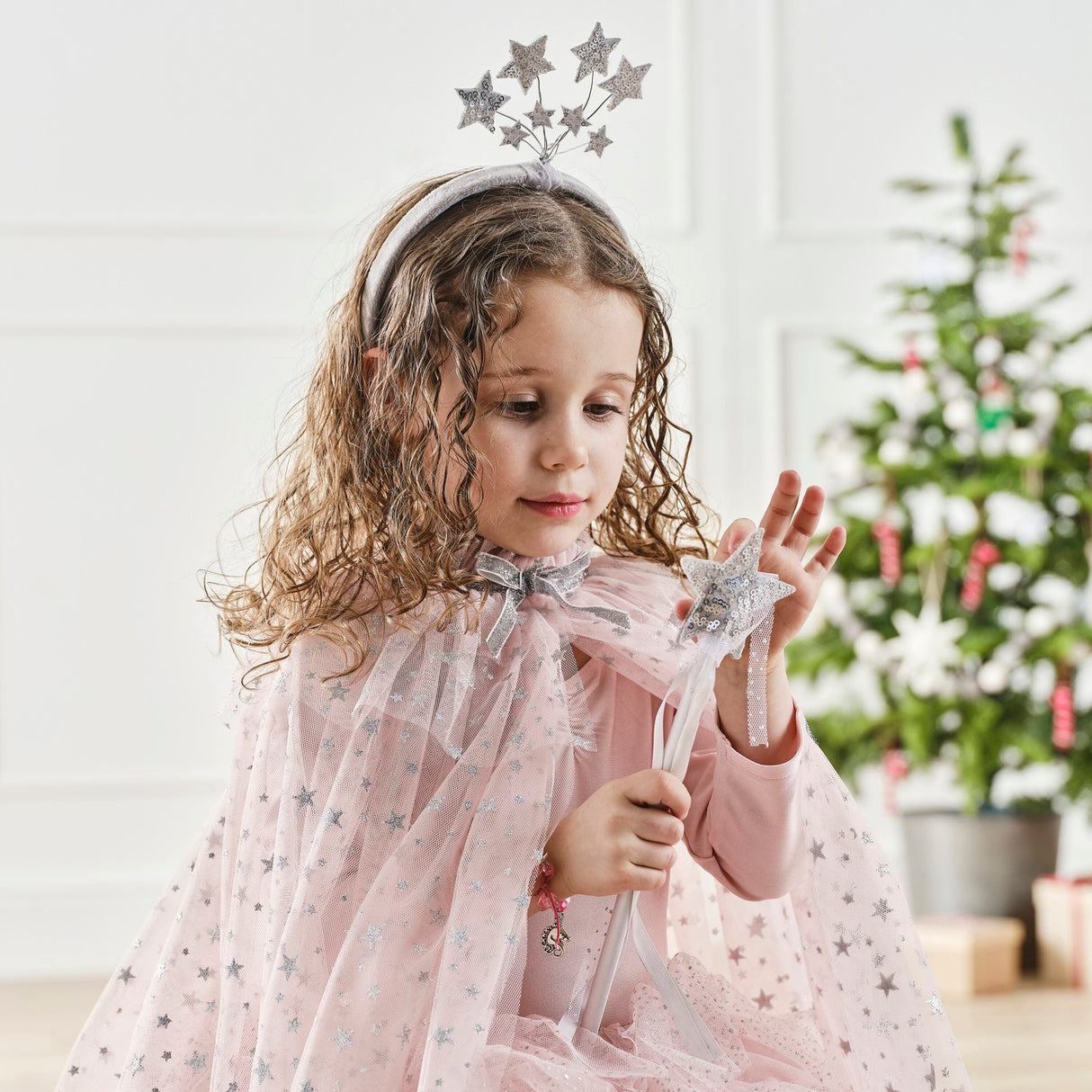 Pink satin fairy wand with a sparkling silver sequin star and ribbons, perfect for magical dress-up and eco-friendly fun.