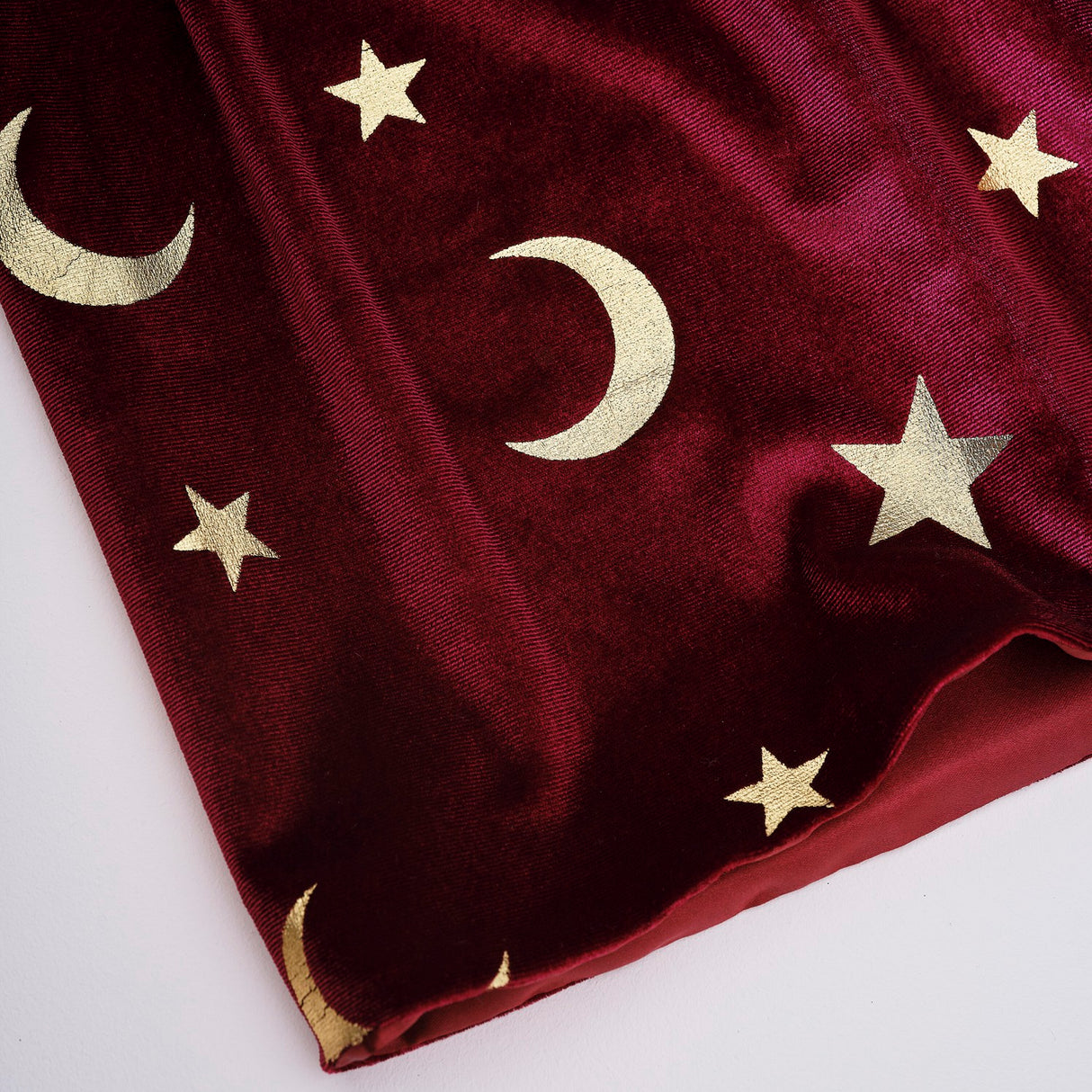 Burgundy velvet magician cape adorned with gold stars and moons, perfect for imaginative dress-up and Halloween fun.