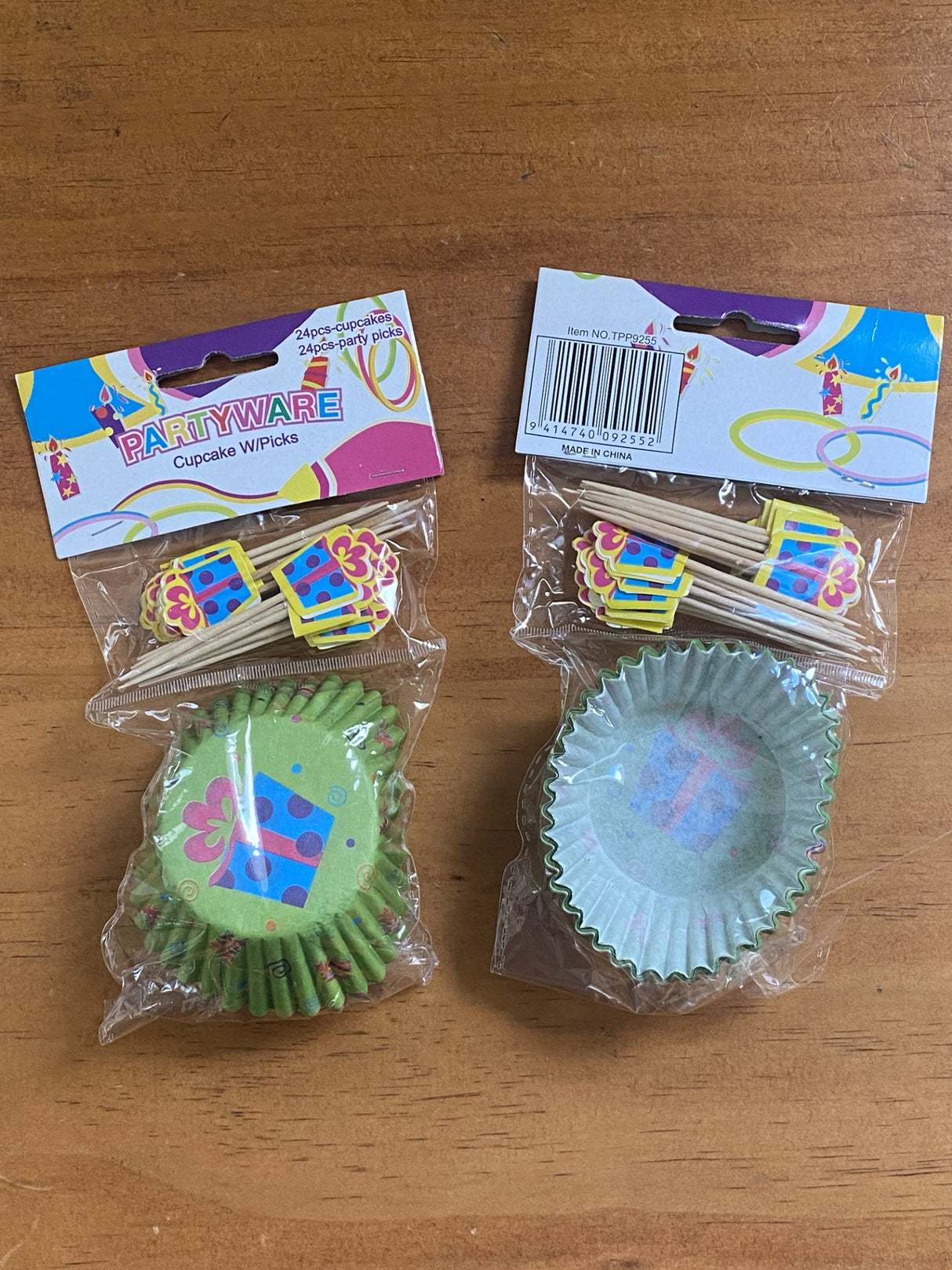 Cupcake case and pick set for birthdays, featuring 48 colorful cupcake liners and 48 festive party picks in two packs.