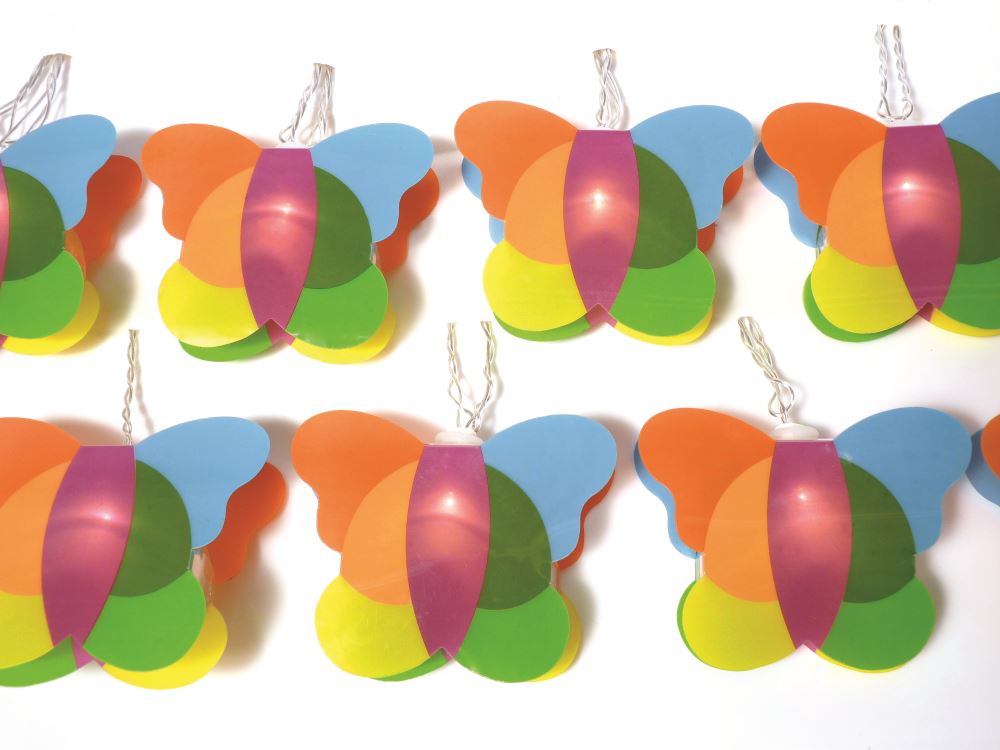 Colorful butterfly fairy lights on clear wire, perfect for adding a whimsical touch to kids' rooms and parties.