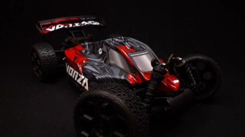 Radio-controlled 1/8 scale Vorza Flux Buggy in vibrant colors, equipped with durable all-terrain tires and advanced suspension.