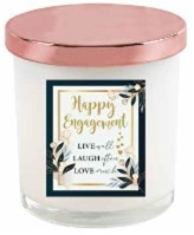 Elegant engagement candle with rose gold lid, perfect for romantic occasions and creating a cozy atmosphere.