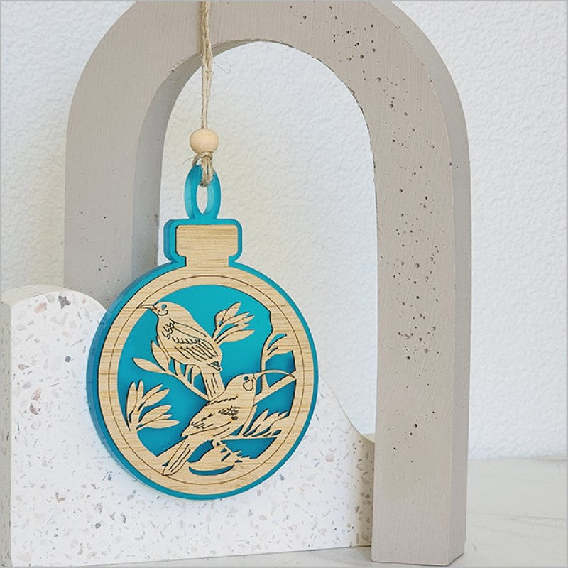 Teal satin acrylic bauble ornament featuring laser-cut bamboo, perfect for festive decorations and gifts.