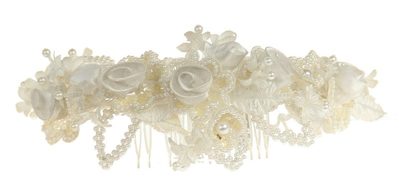 Elegant white pearl bridal comb with silver accents, perfect for enhancing wedding hairstyles and adding sophistication.