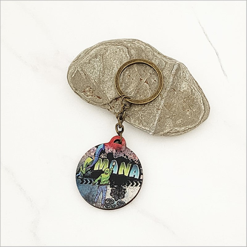 Stylish Grafiti Mana printed keychain made from lightweight pine veneer, showcasing Kiwiana flair and modern design.