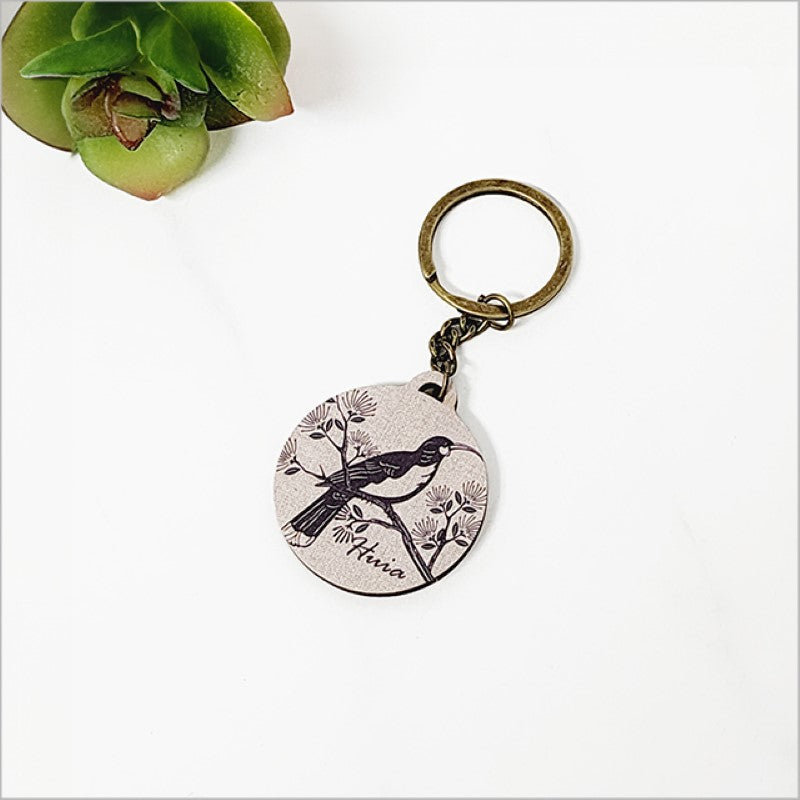 Lightweight printed pine veneer keychain, featuring Kiwiana design, perfect for organizing keys and gifting.