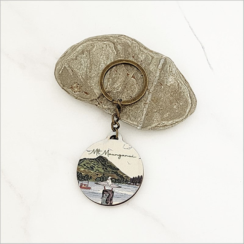 Lightweight pine veneer keychain featuring Mt Maunganui design, perfect for Kiwiana-inspired gifts or souvenirs.