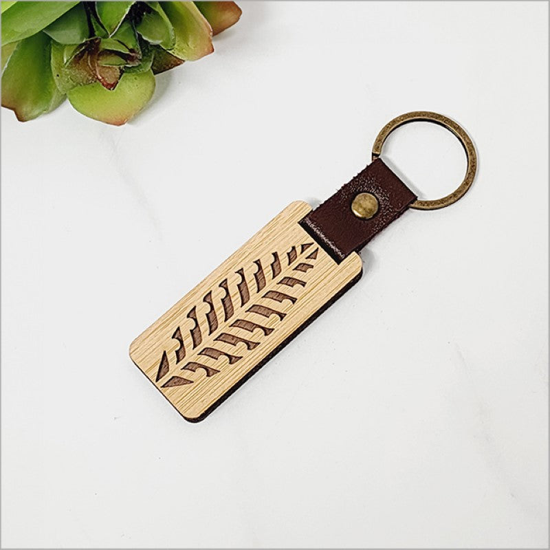 Eco-friendly bamboo keyring KWW 1, laser cut with Kiwiana charm, lightweight and stylish for key organization.