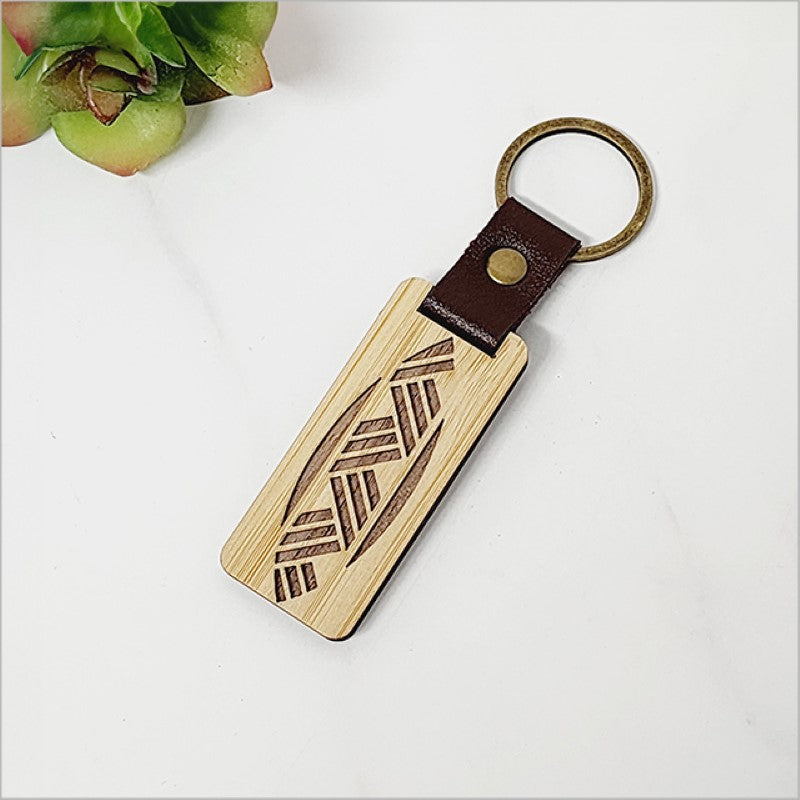 Eco-friendly bamboo keyring with intricate weave design, perfect for organizing keys and showcasing Kiwiana style.