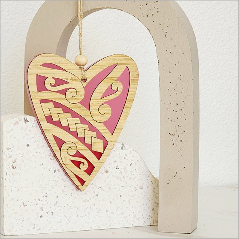 Heart-shaped pink satin acrylic hanging ornament, crafted from laser-cut bamboo, perfect for decor or heartfelt gifts.