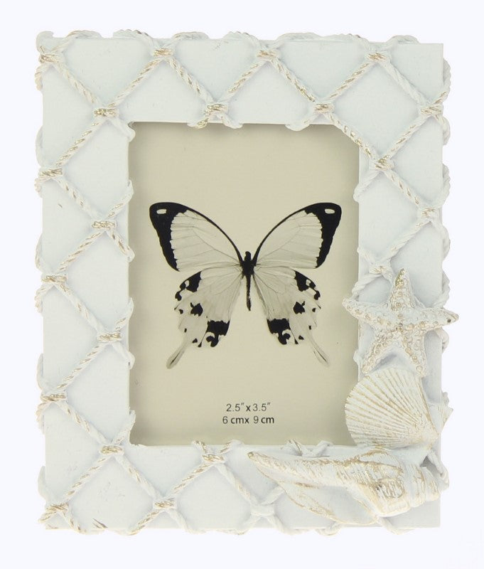 Elegant set of 2 white frames resembling fishing nets adorned with seashells, perfect for coastal decor and showcasing photos.