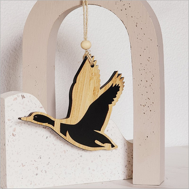 A stylish black satin acrylic duck hanging ornament, featuring a laser-cut design, ideal for modern decor and gifts.