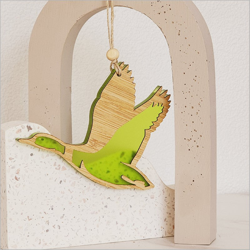 Lime satin acrylic duck hanging ornament, intricately laser cut, perfect for adding whimsy to your decor or gifting.