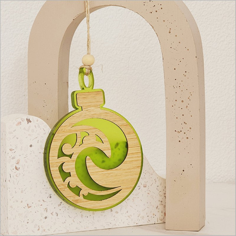 Vibrant lime satin acrylic hanging ornament with intricate Koru design, perfect for festive or year-round decor.