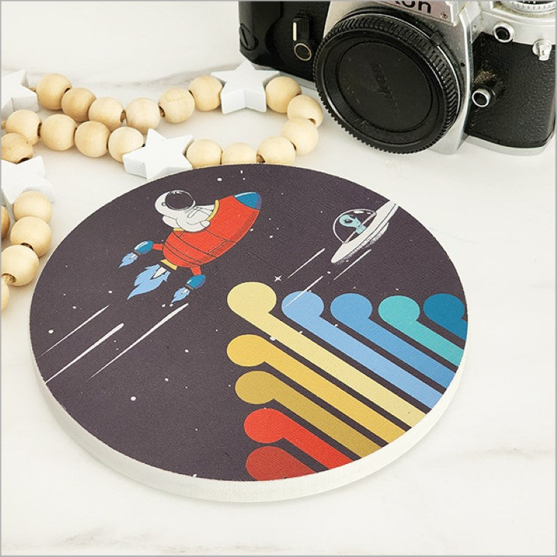 Vibrant small printed canvas circle featuring outer space and Koru designs, ideal for home decor or gifting.