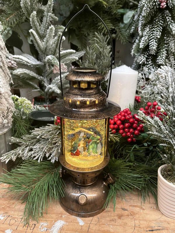 Festive ornament of a Coleman lamp featuring Santa, radiating warm holiday cheer for your Christmas decor.