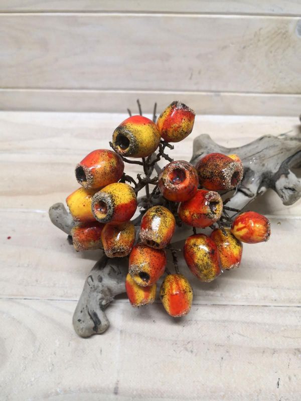 Vibrant orange artificial eucalyptus nut bundle, perfect for modern decor or rustic styles, adding charm to any space.