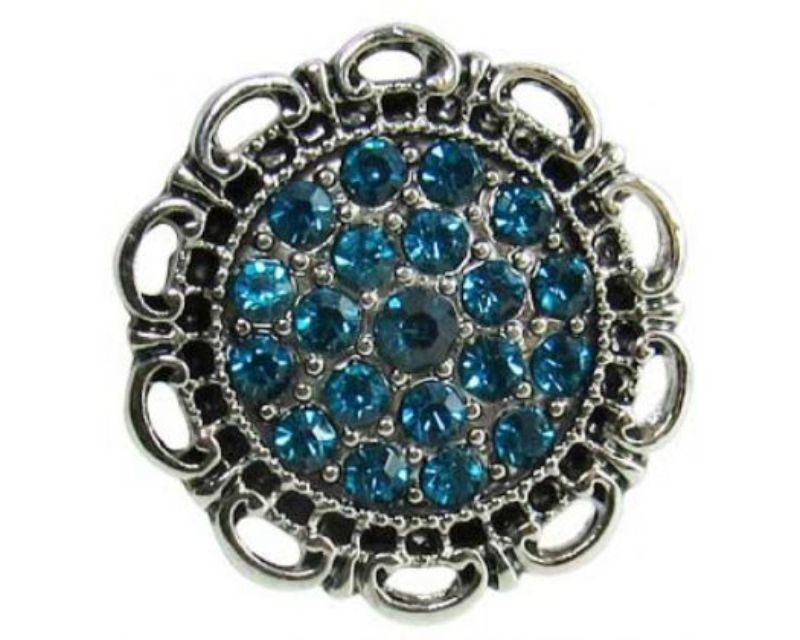Blue diamante shield accessory with sparkling details, perfect for elevating everyday and special occasion outfits.